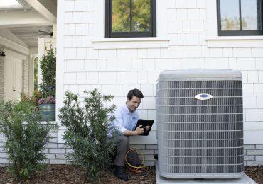 Sandium technician performing AC system tune-up in San Jose home