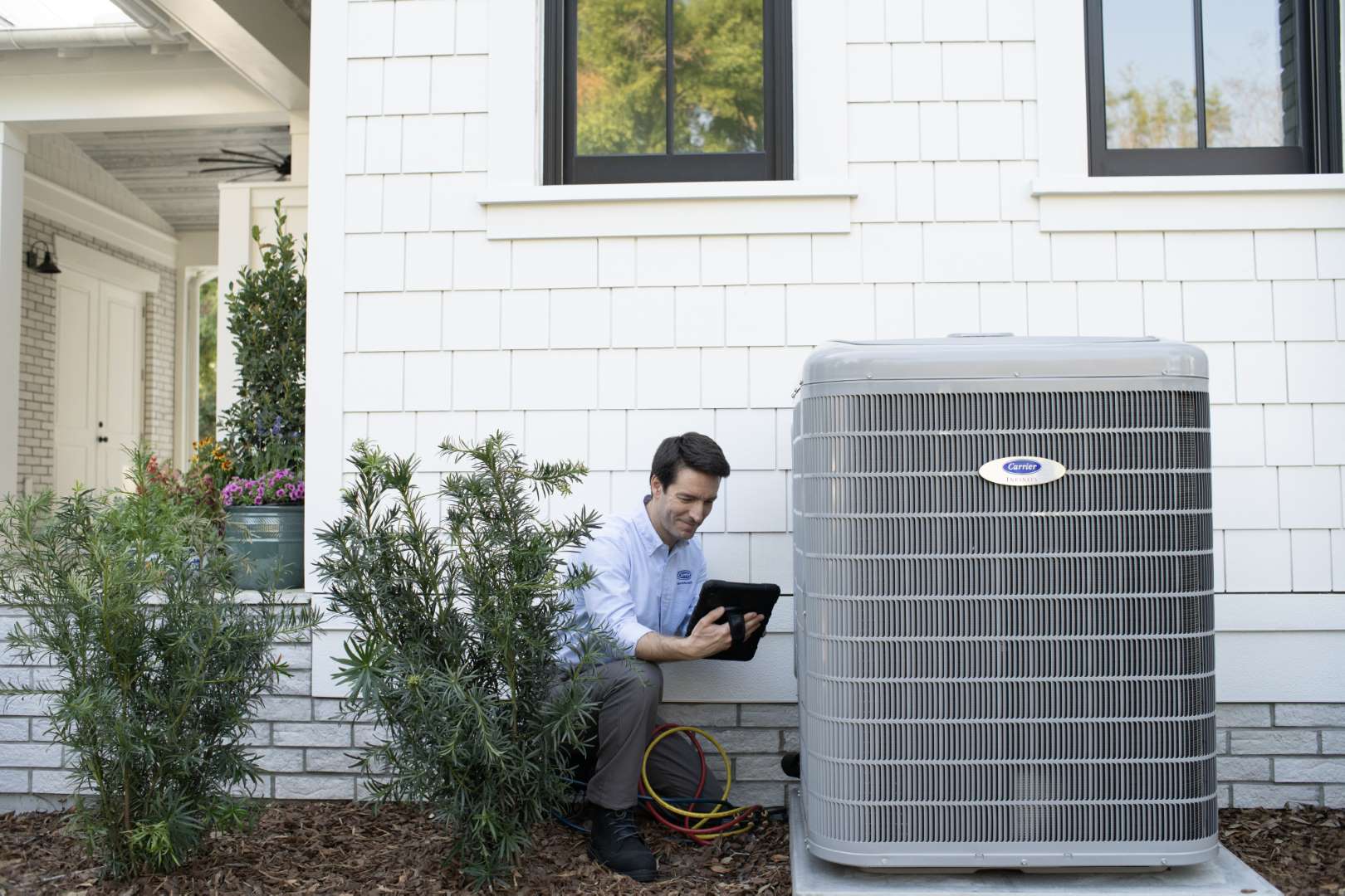 Sandium technician performing AC system tune-up in San Jose home