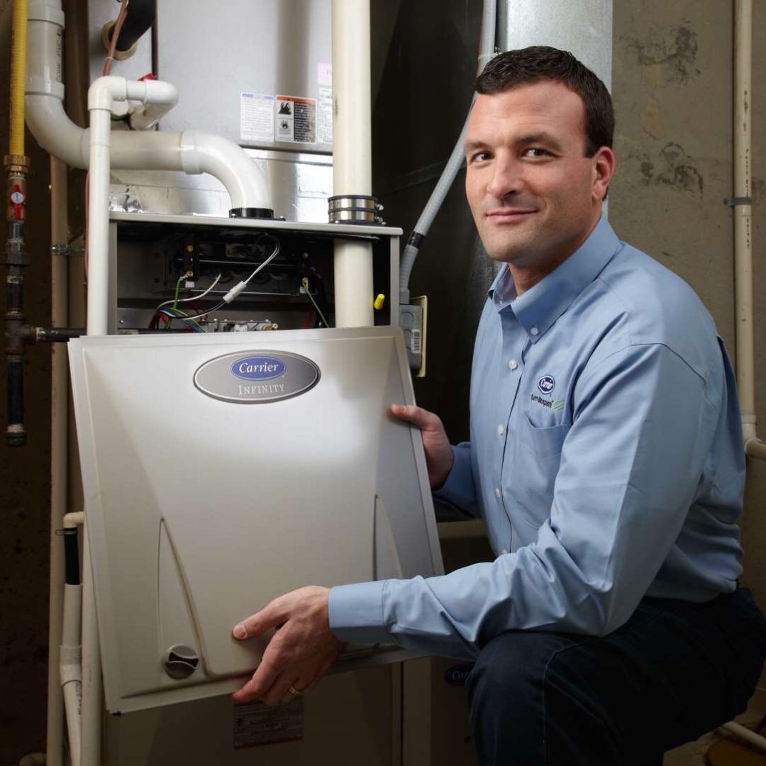 Sandium HVAC technician servicing AC unit in a Sunnyvale home