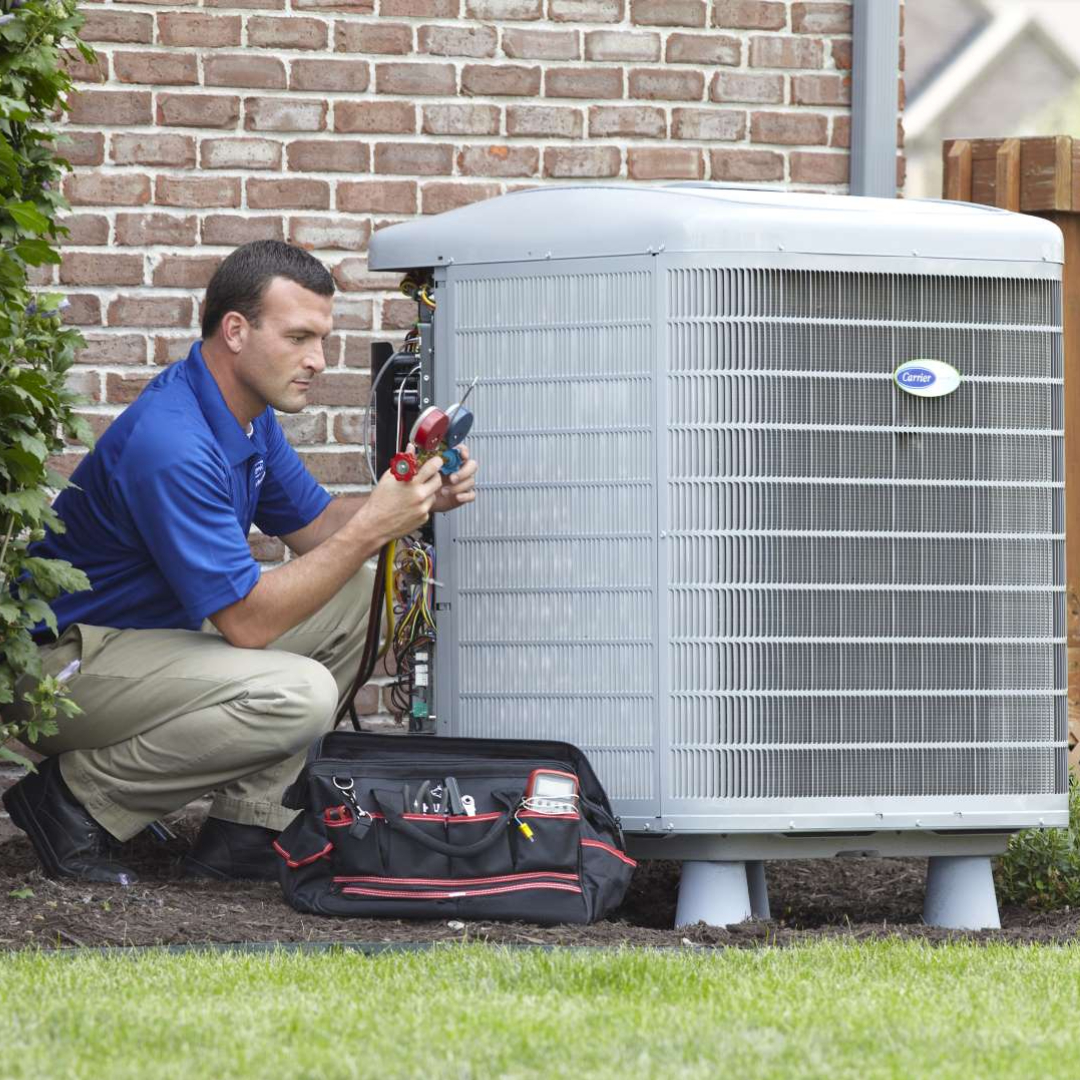 Sandium HVAC technician servicing AC unit in a Mountain View, CA home