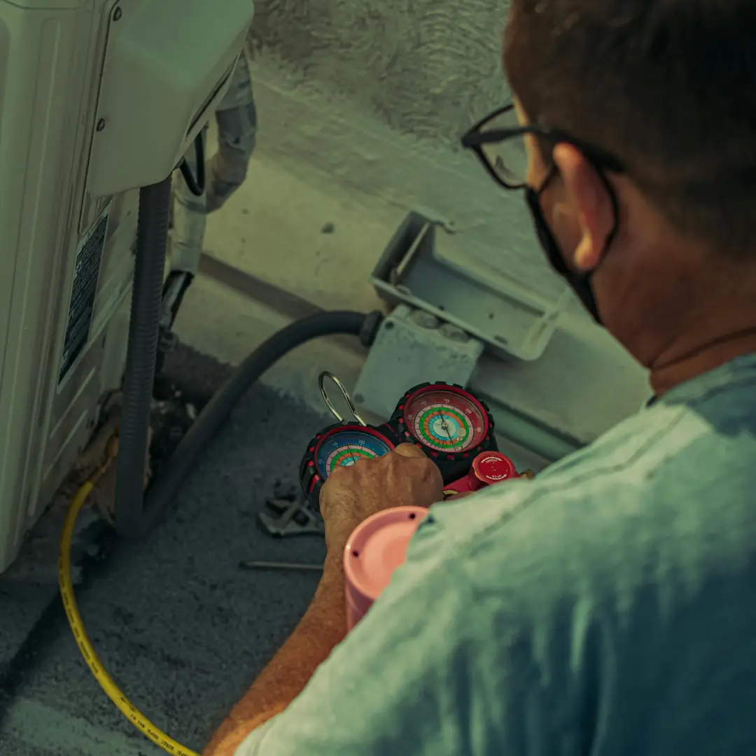 Sandium technician removing old AC unit before installing new system in San Jose, CA